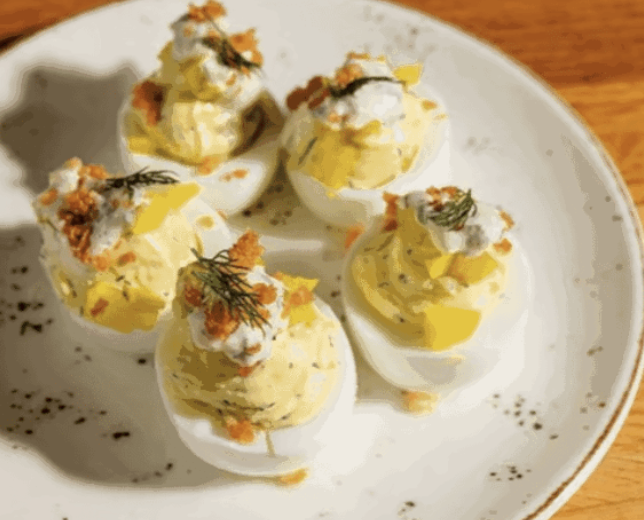 Whiskey Cake Kitchen & Bar signature dishes Whiskey CakeDeviled EggsRotisserie Farm Bird